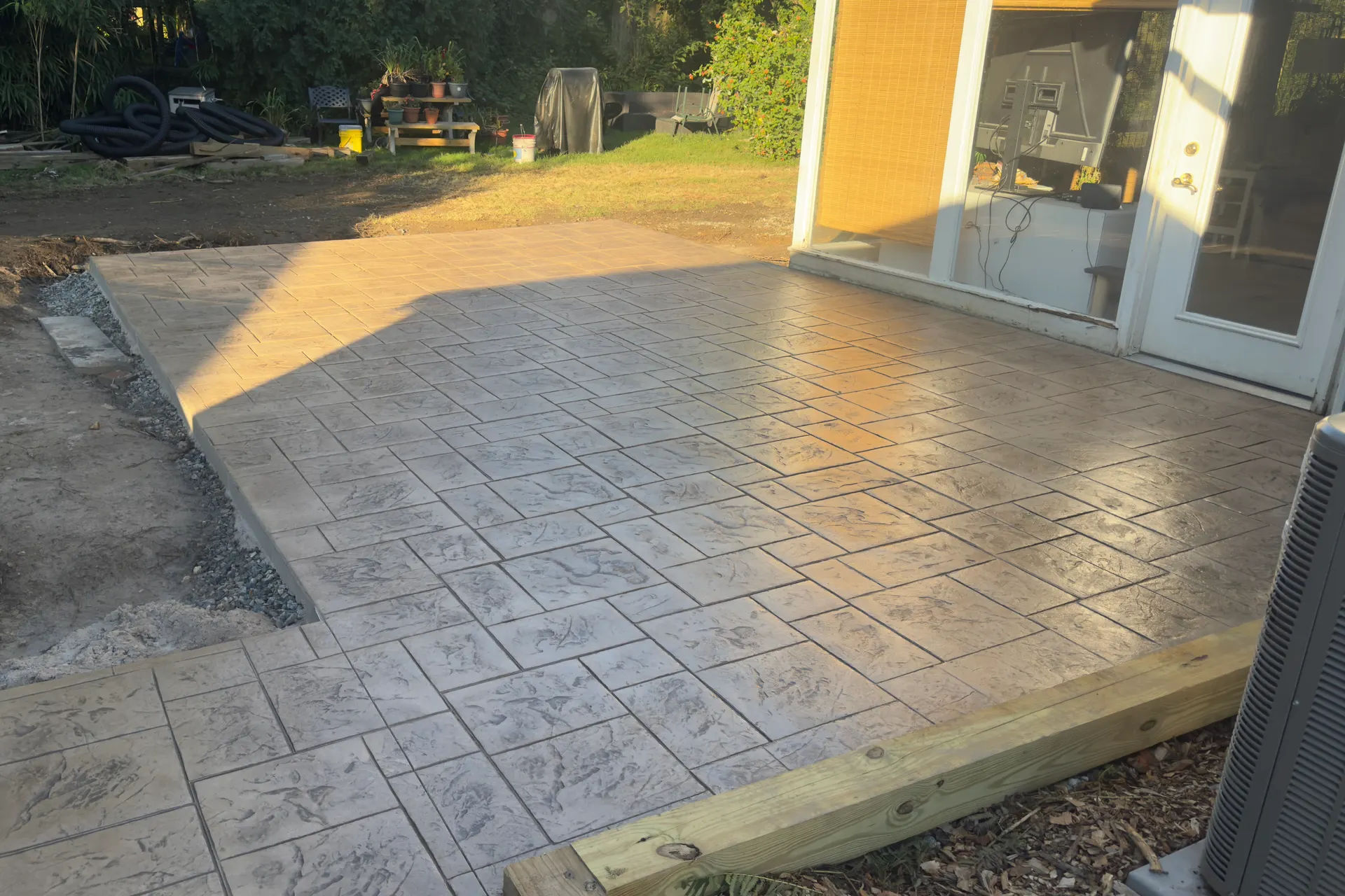 A finished stamped concrete patio poured and stamped by Blue Rock Concrete